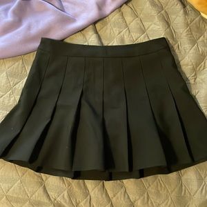 black pleated mini skirt